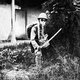 China: Imperial Japanese soldier posing with samurai sword and gas mask, Shanghai, 1937